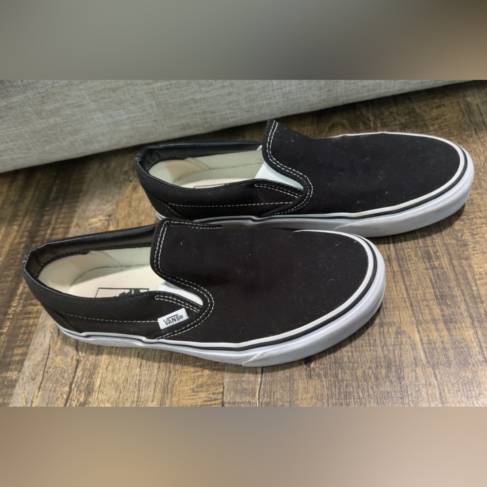 Vans Women’s Black and White Slip-On Sneakers
